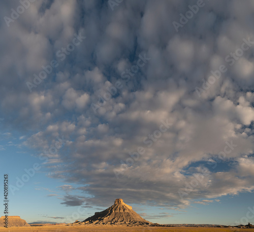 USA, Utah. Early morning clouds at Factory Butte, Upper Blue Hills. photo