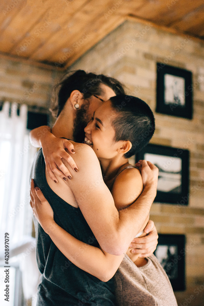 Couple hugging at home Couple hugging at home