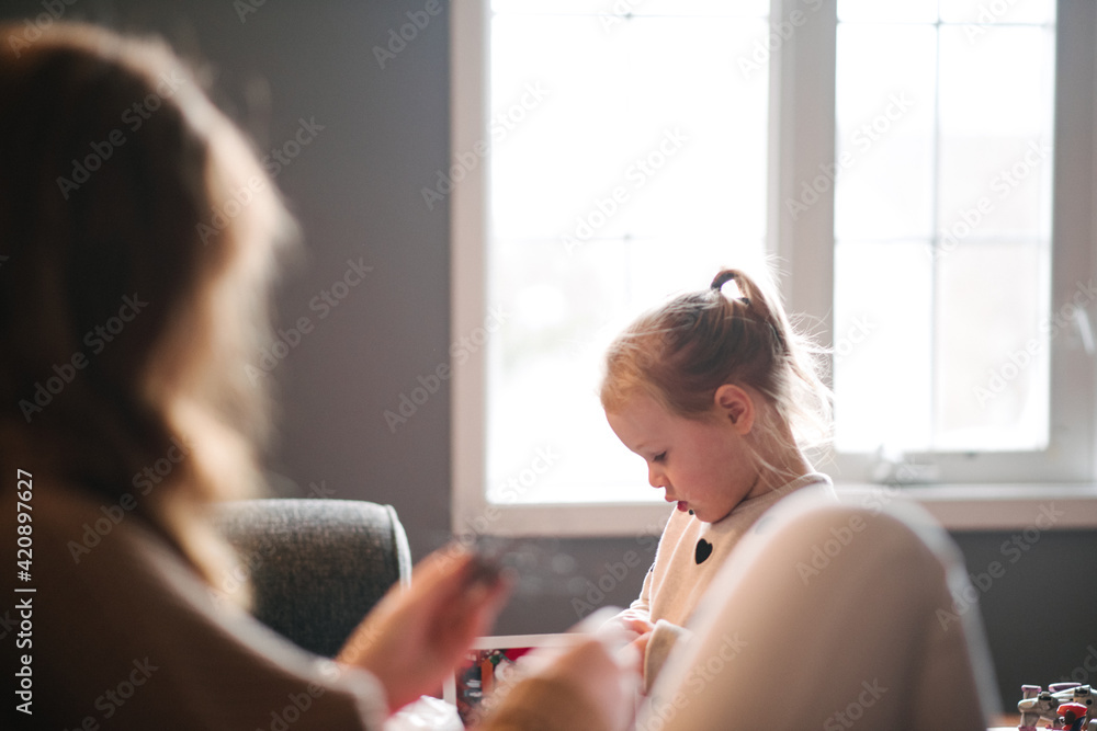 Woman and toddler girl at home Woman and toddler girl at home