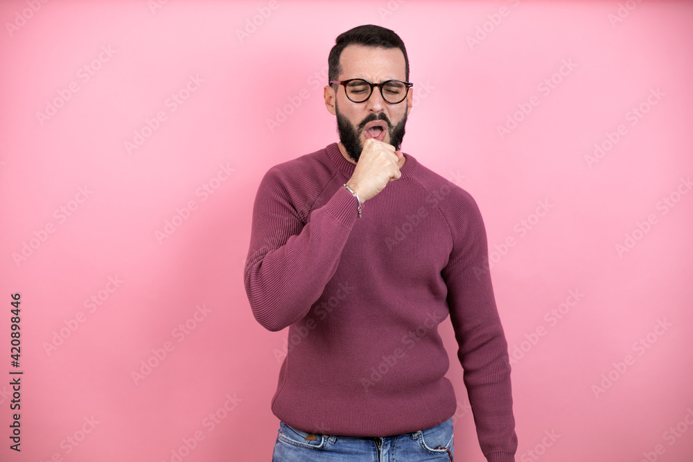 Handsome man wearing glasses and casual clothes over pink background coughing Handsome man wearing glasses and casual clothes over pink background coughing