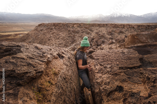 Climber stuck in offwidth crack, Sierra Nevada, Bishop, California, USA photo