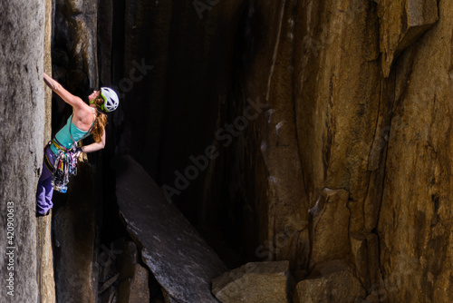 Climber rock climbing, Cookie Cliff, Yosemite National Park, California, United States