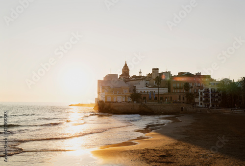 Sunset over beach, Sitges, Catalonia, Spain photo