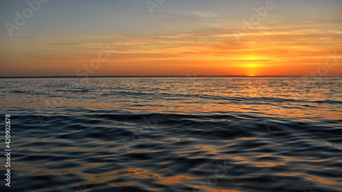 Sunset over water with shallow depth of field