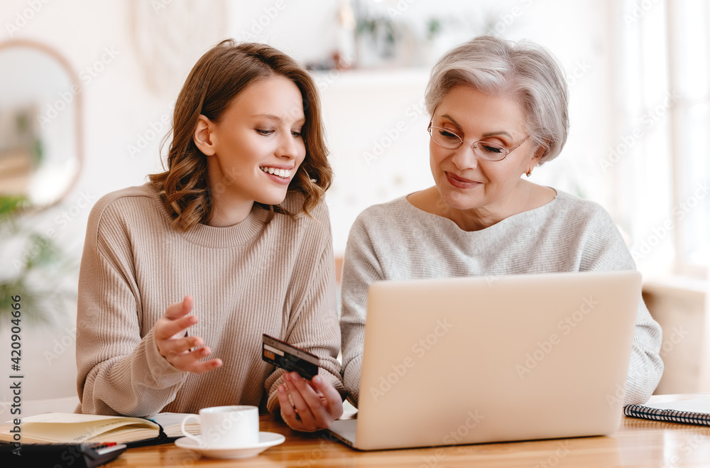 Grandmother and granddaughter shopping online