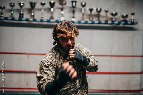 Boxer training in boxing ring photo