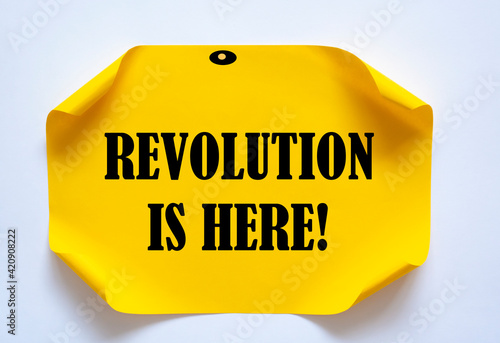 Revolution is Here write on Sticky Notes.