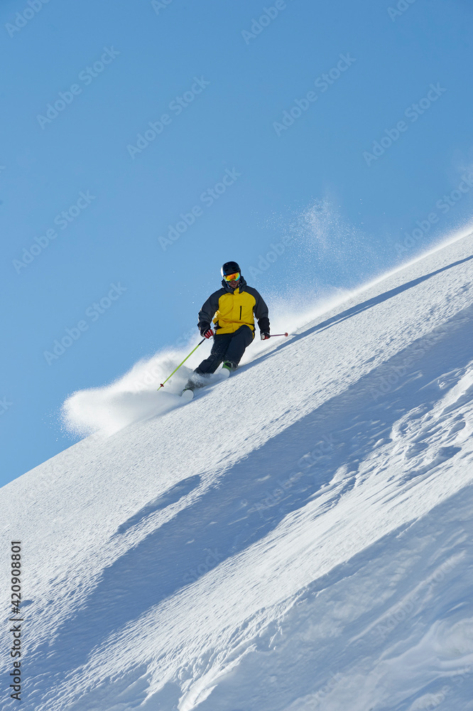 Skier moving down slopes, Saas-Fee, Valais, Switzerland Skier moving down slopes, Saas-Fee, Valais, Switzerland