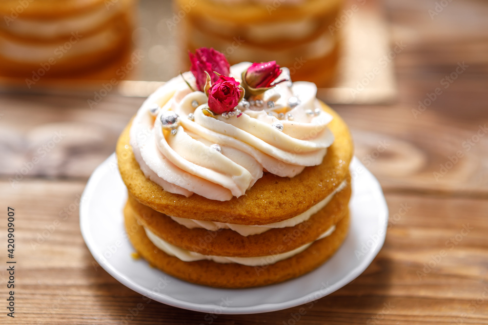 Sponge cake with cream, decorated with small flowers. Sponge cake with cream, decorated with small flowers.