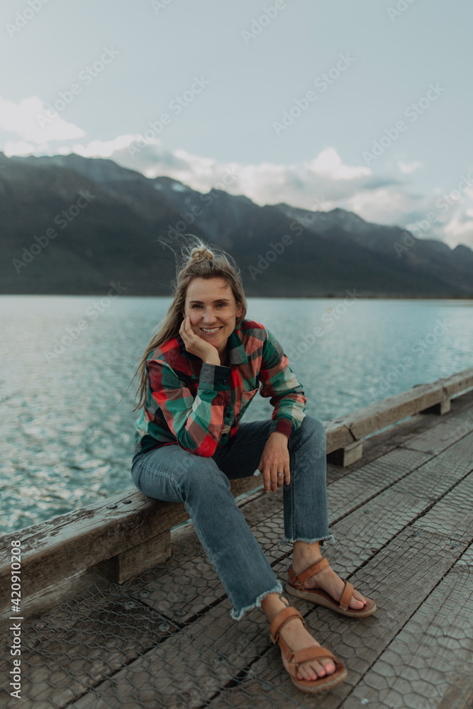 Woman enjoying scenic lake view, Queenstown, Canterbury, New Zealand Woman enjoying scenic lake view, Queenstown, Canterbury, New Zealand