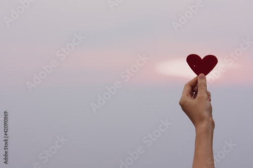hand holding red heart on sky copy spec, Red heart love in valentine's day, World heart day