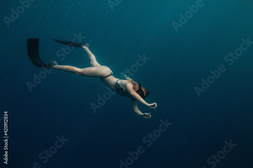 Wallpaper Mural Woman swimming underwater Torontodigital.ca