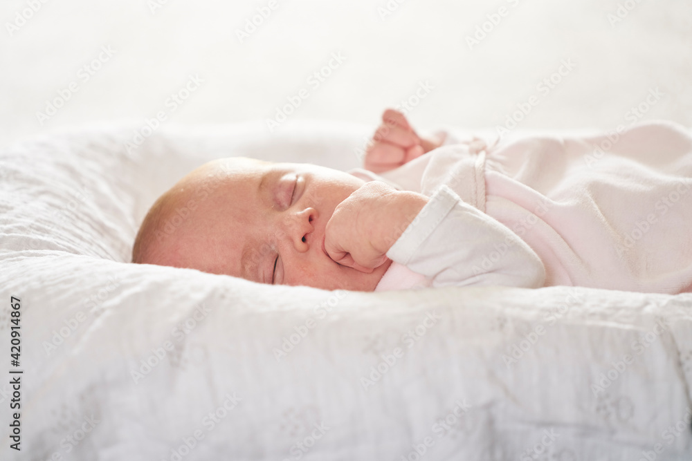 Baby sleeping on U-shaped pillow at home Baby sleeping on U-shaped pillow at home