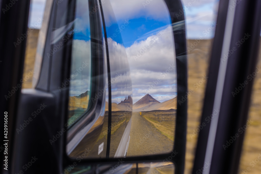 Abstract view of mountain landscape reflected through car window and bodywork, Akureyri, Eyjafjardarsysla, Iceland Abstract view of mountain landscape reflected through car window and bodywork, Akureyri, Eyjafjardarsysla, Iceland