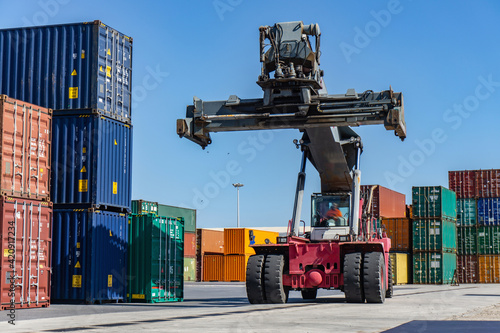 Reach stacker and shipping containers in dock