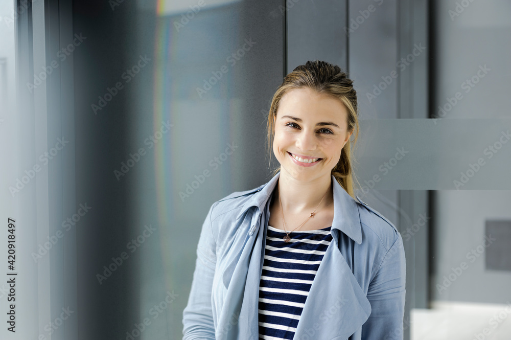 Female student at corridor of office building Female student at corridor of office building