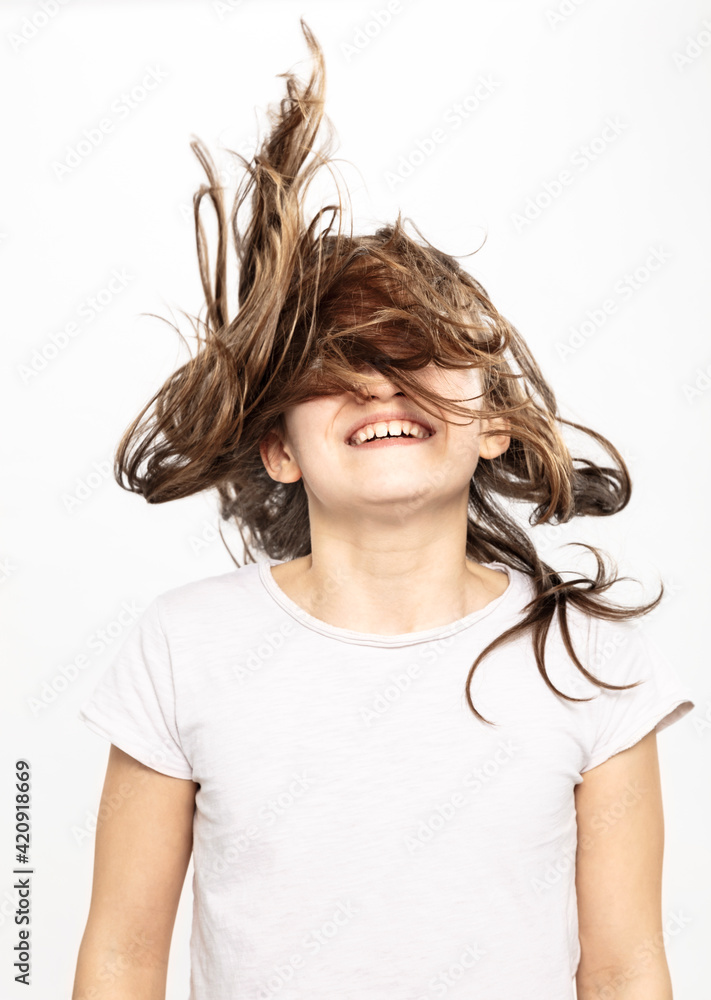 Happy girl with flying hair, white background Happy girl with flying hair, white background