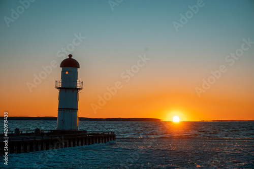 lighthouse at sunset © Ashek