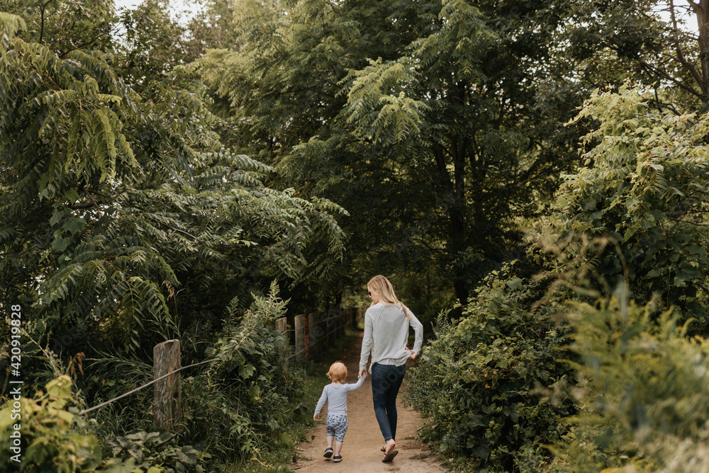 Mother and son taking walk in forest Mother and son taking walk in forest