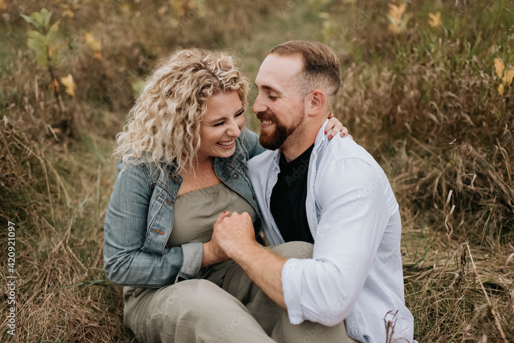 Young couple hugging and talking in countryside Young couple hugging and talking in countryside