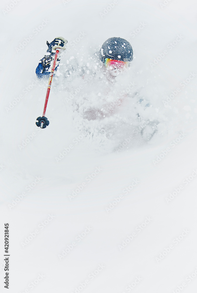 Skier skiing and splashing snow Skier skiing and splashing snow