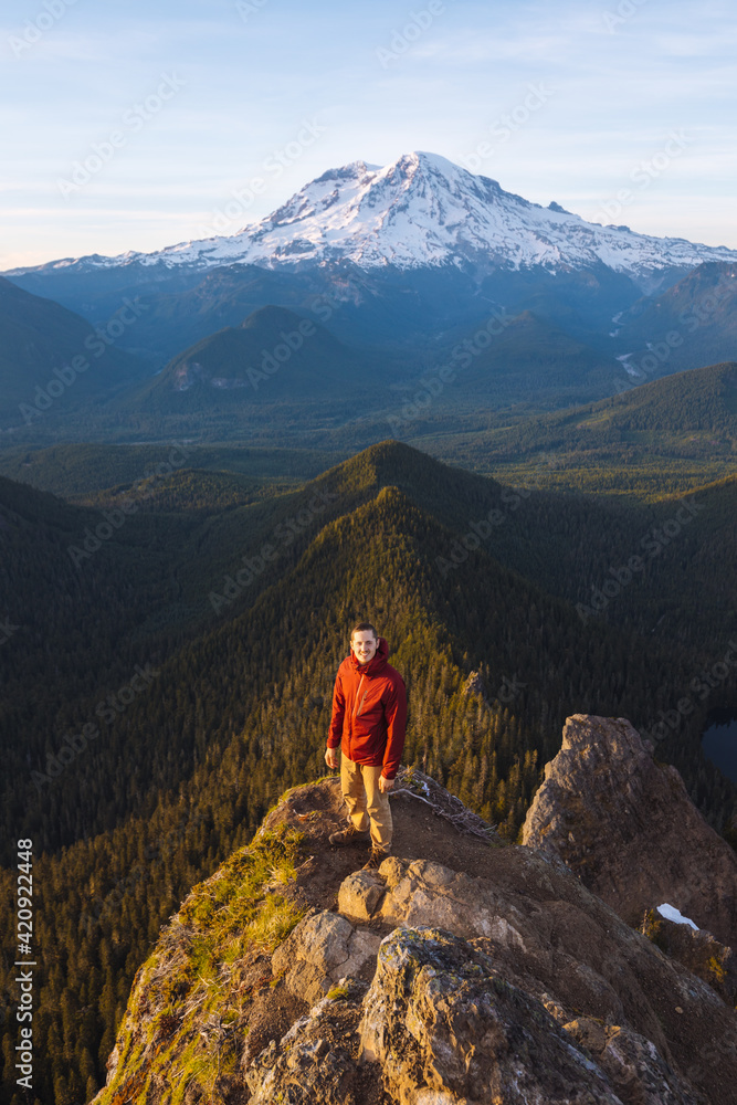 Male hiker on a peak in Mount Rainier National Park. Male hiker on a peak in Mount Rainier National Park.