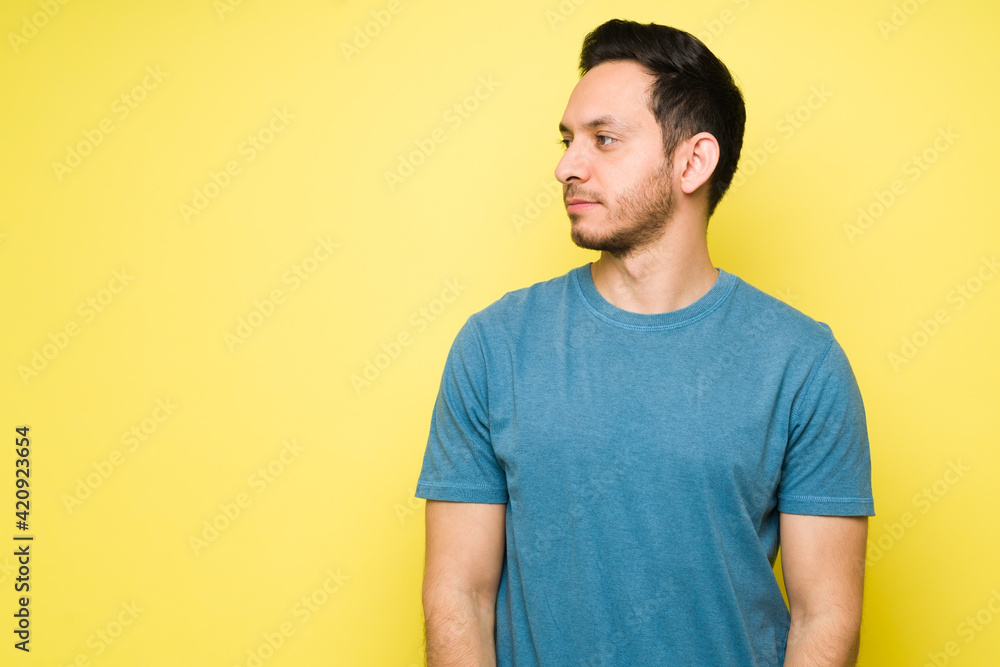 Portrait of a man posing in a studio with casual clothes Portrait of a man posing in a studio with casual clothes