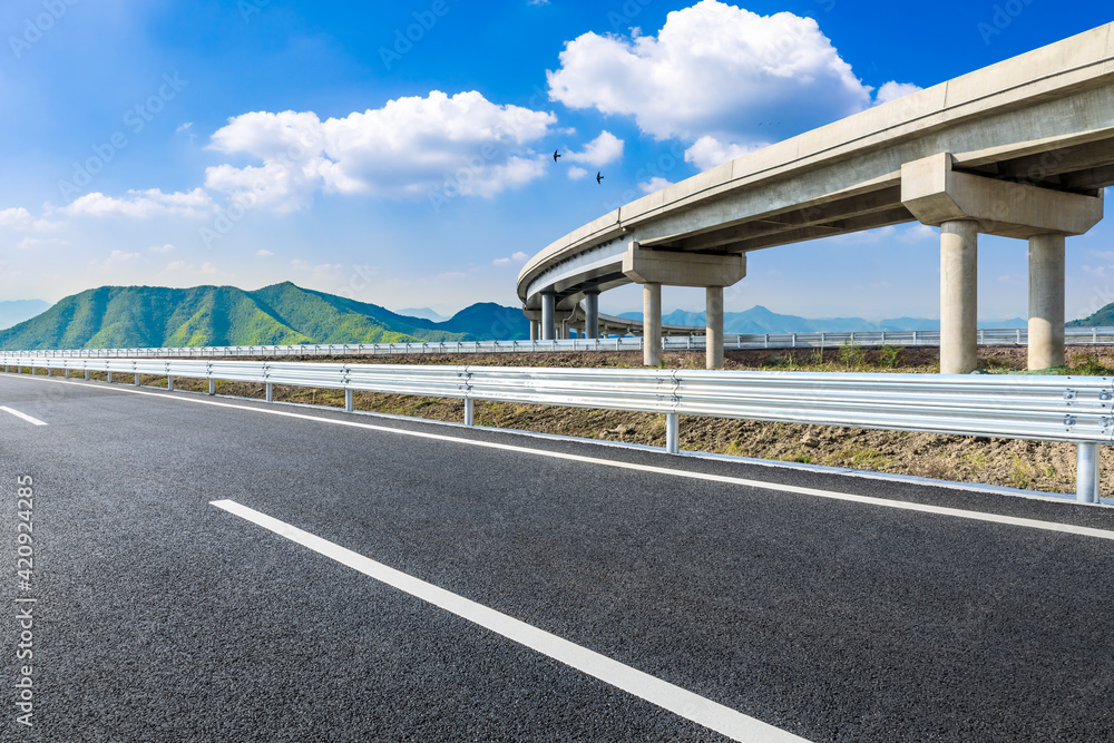 Asphalt highway and green mountains in summer. Asphalt highway and green mountains in summer.