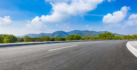 country road and green mountains in summer.