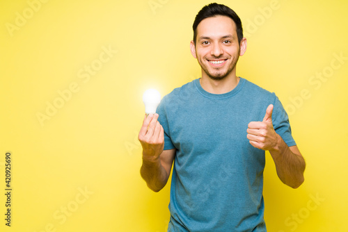 Attractive man smiling while thinking a new idea