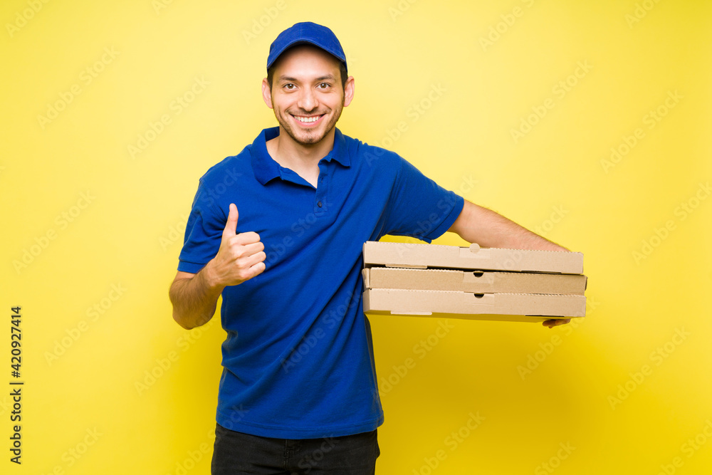 Hispanic young man making a fast food delivery Hispanic young man making a fast food delivery
