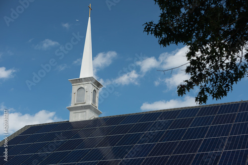 Washington, DC, USA - 27 August 2020: Solar Panels on the Roof of a Baptist Church on a sunny Day with blue Sky
