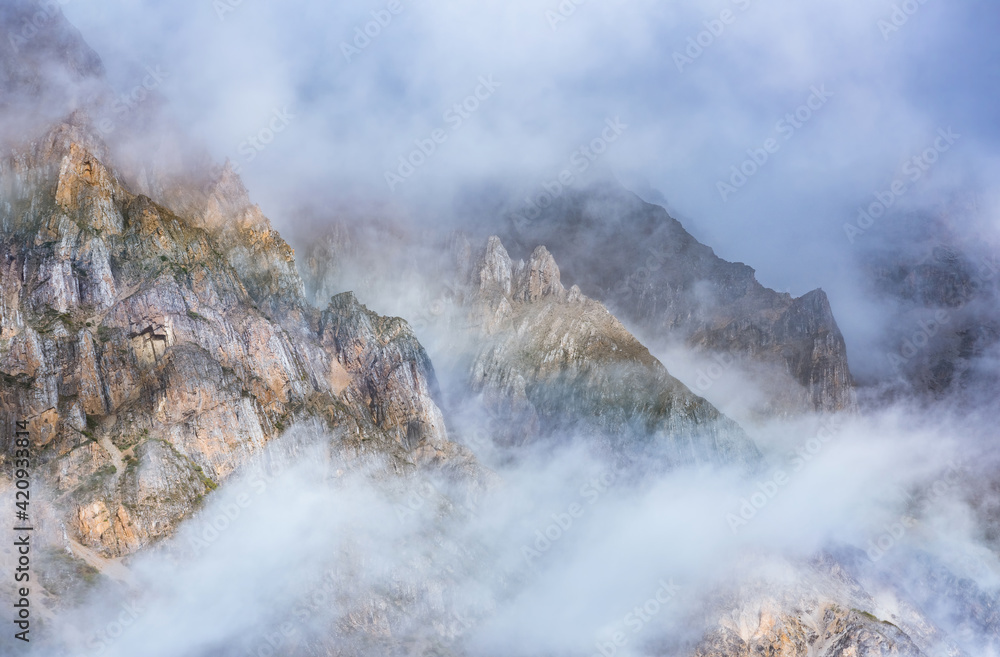 Misty mountains and rainbows in the early morning