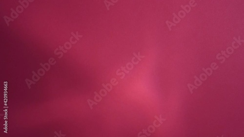 A waver light on a pink background