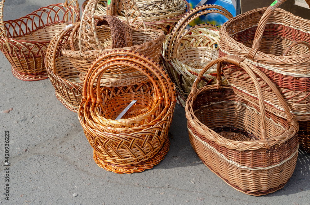 New wicker baskets in the street market. New wicker baskets in the street market.