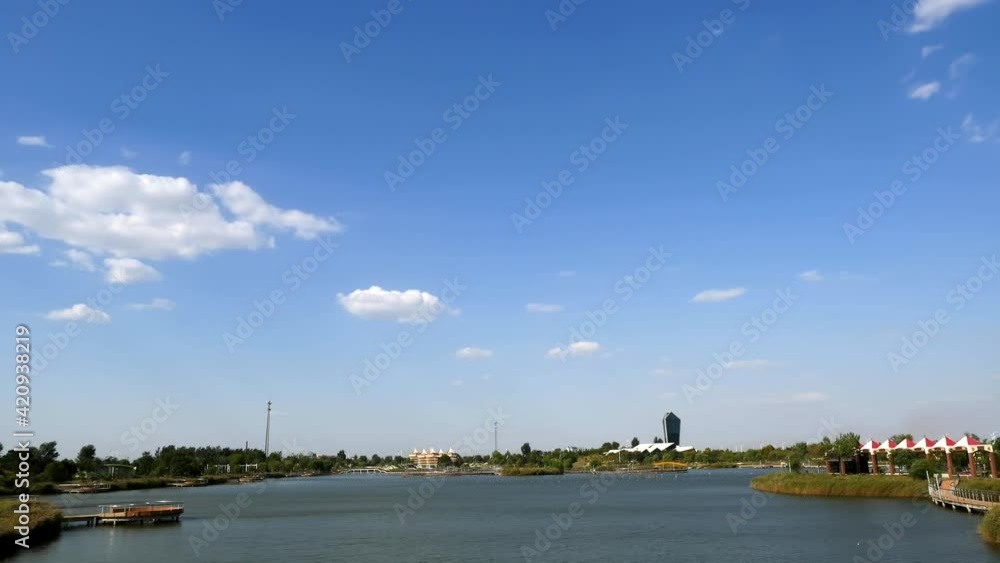 Lake view in city park in sunny winter, time-lapse Lake view in city park in sunny winter, time-lapse