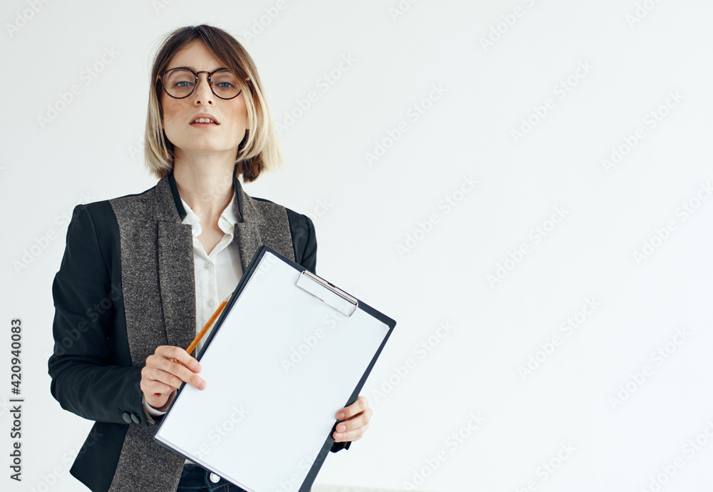Business woman in a jacket manager model glasses and a white sheet of paper Business woman in a jacket manager model glasses and a white sheet of paper