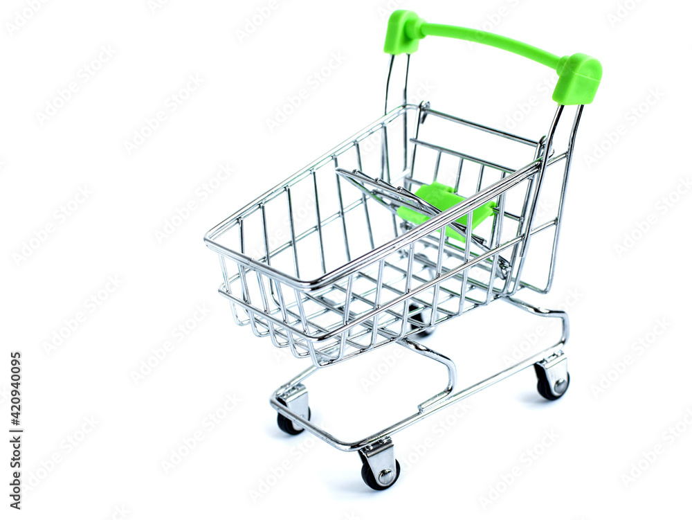 Empty supermarket shopping cart isolated on white background, grocery cart. The concept of buying and selling goods on the Internet. Selective focus, copy space. Empty supermarket shopping cart isolated on white background, grocery cart. The concept of buying and selling goods on the Internet. Selective focus, copy space.