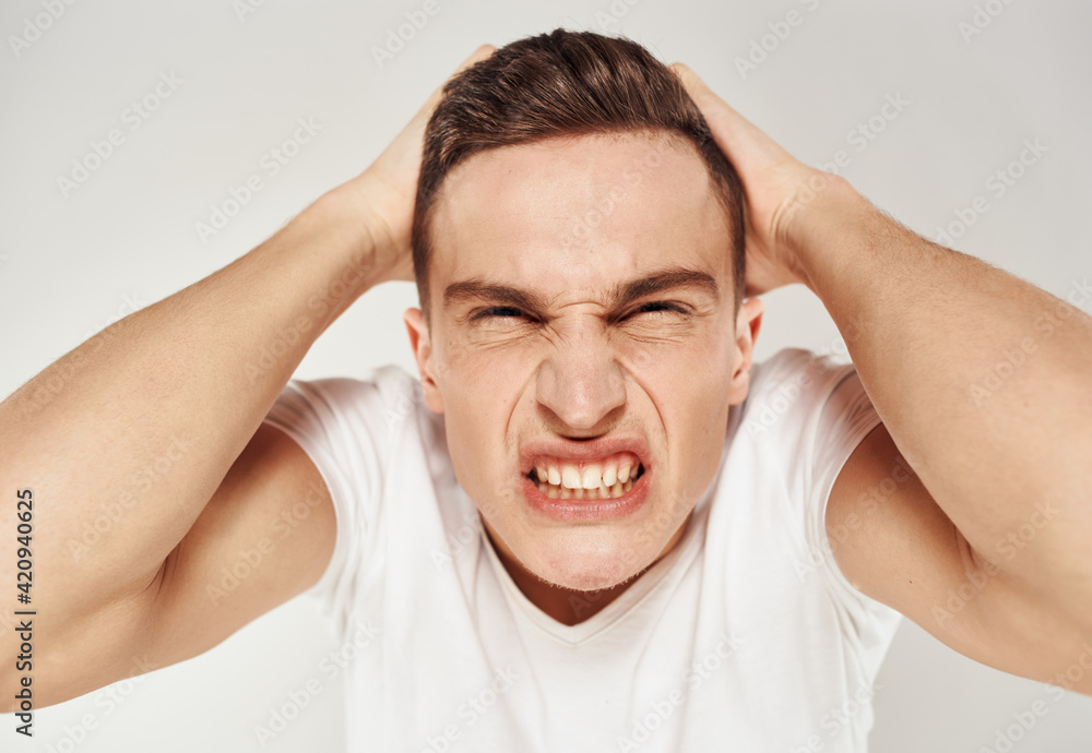 Nervous man touches his head stress Model of emotion Nervous man touches his head stress Model of emotion