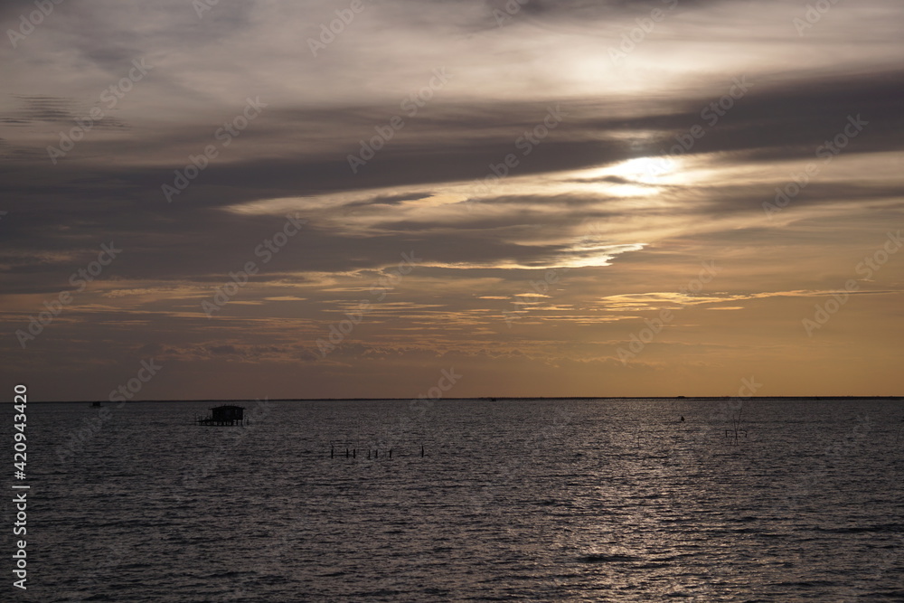 Fototapeta premium Beautiful evening sun over the sea in Thailand