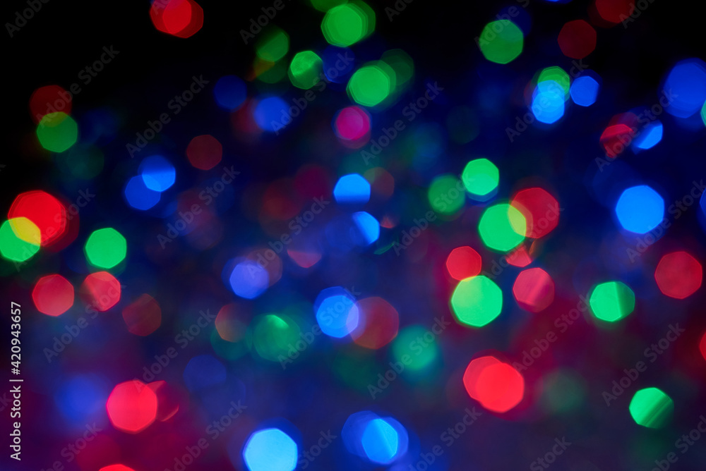 Blurred background, multicolored Christmas, New Year garland out of focus. Blurred background, multicolored Christmas, New Year garland out of focus.