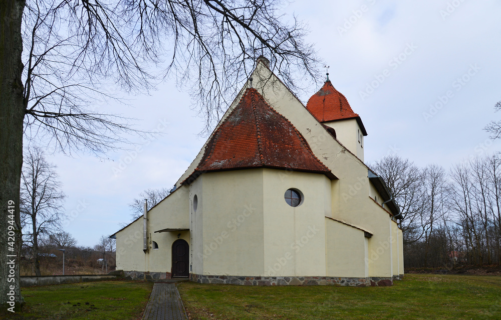 built at the beginning of the 20th century in an eclectic style, a Catholic church dedicated to the Blessed Virgin Mary, the mother of the church in the village of Baranowo in Warmia and Masuria in Po
