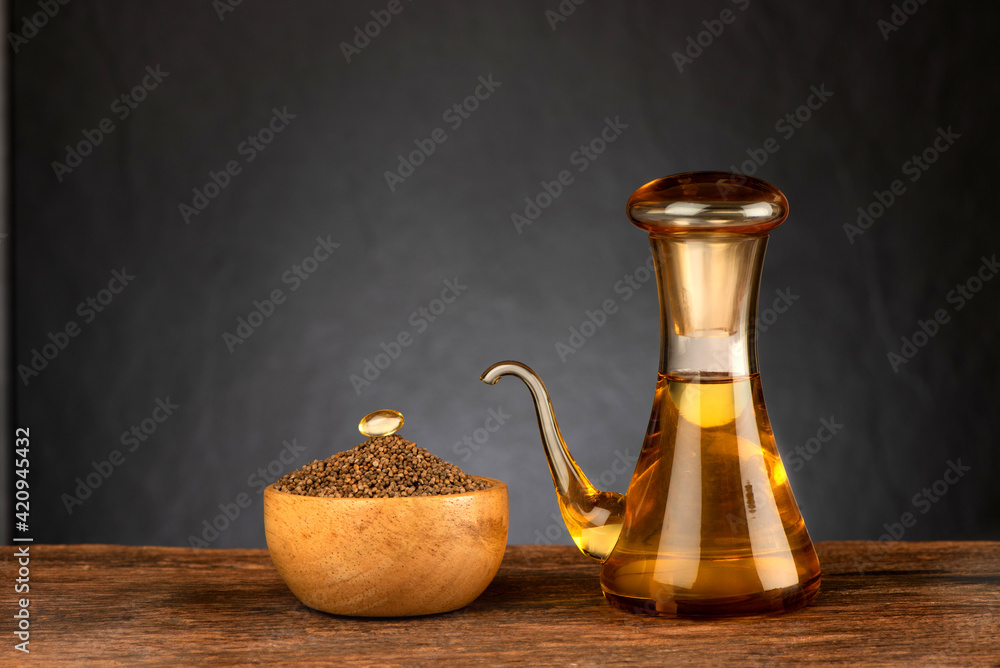 Perilla seeds and oil on black background. Perilla seeds and oil on black background.