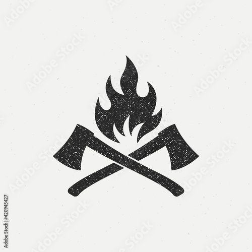 Black and white illustration of crossed axes, fire on a background with a texture. Vector illustration in vintage style with grunge texture for emblem, print, label, badge and sticker.