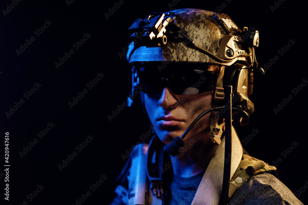Portrait of special forces soldier in helmet and glasses in the dark Stock  Photo | Adobe Stock