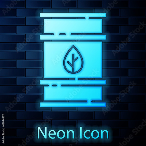 Glowing neon Bio fuel barrel icon isolated on brick wall background. Eco bio and canister. Green environment and recycle. Vector