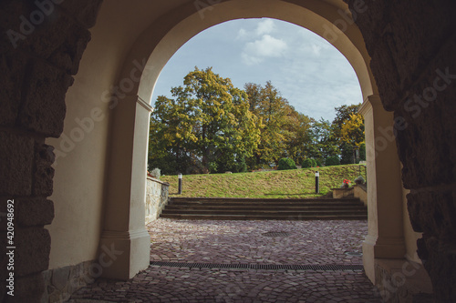 Przemysl or Casimir Castle, XIV century is a renaissance citadel in Przemysl, Poland. It located on the Castle Hill. View of the courtyard of the fortress from the entrance arch. photo