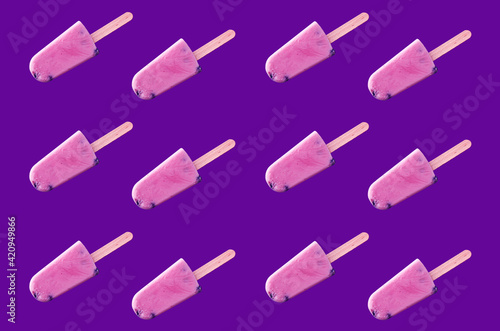 Tasty blueberry ice creams on violet background