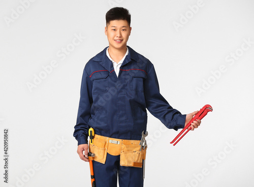 Asian worker on white backg...
