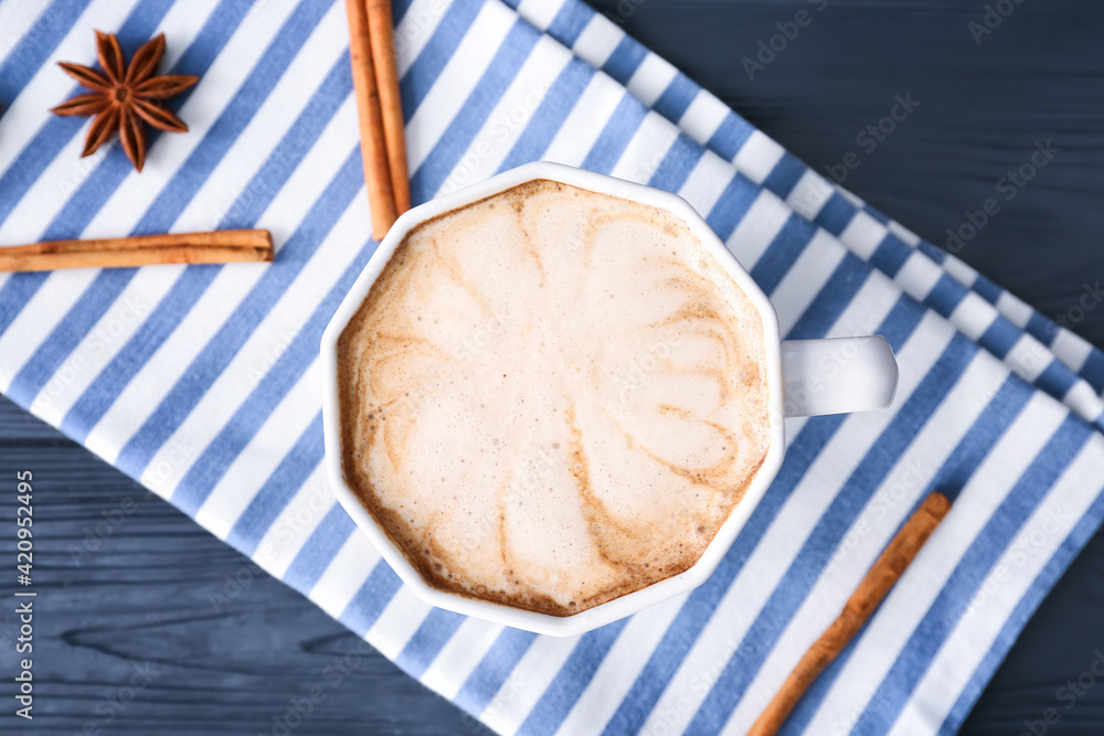 Cup of tasty latte on dark wooden background Cup of tasty latte on dark wooden background